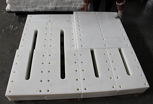 UHMW drag conveyor paddles